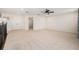 Spacious loft area with carpet flooring, ceiling fan, and neutral paint palette at 19209 Long Lake Ranch Blvd, Lutz, FL 33558