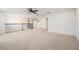 Bright loft area with carpet flooring, iron railing, and neutral paint palette at 19209 Long Lake Ranch Blvd, Lutz, FL 33558
