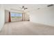 Main bedroom featuring carpet flooring, tray ceiling, and lots of natural light at 19209 Long Lake Ranch Blvd, Lutz, FL 33558
