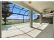 Enjoy the expansive screened patio with a lake view, perfect for relaxing or entertaining at 19209 Long Lake Ranch Blvd, Lutz, FL 33558