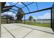 The screened patio offers serene lake views, ideal for enjoying the outdoors in comfort and style at 19209 Long Lake Ranch Blvd, Lutz, FL 33558