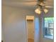 Bright bedroom features a window and ceiling fan with a light fixture at 1922 Blue Sage Ct, Brandon, FL 33511
