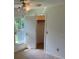 Bedroom features a window with a view, a ceiling fan with light, and closet at 1922 Blue Sage Ct, Brandon, FL 33511