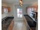 Cozy kitchen featuring stainless steel appliances, granite countertops, and a window view to the exterior at 1922 Blue Sage Ct, Brandon, FL 33511