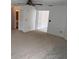 Spacious living room features bright doorways, plush carpeting and a ceiling fan at 1922 Blue Sage Ct, Brandon, FL 33511
