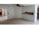 This bright living room features a passthrough to the kitchen and a ceiling fan at 1922 Blue Sage Ct, Brandon, FL 33511
