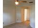 Spacious main bedroom with a ceiling fan, carpeted floors, and neutral walls and trim at 1922 Blue Sage Ct, Brandon, FL 33511