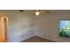 Spacious main bedroom with a ceiling fan and view to the exterior through the window at 1922 Blue Sage Ct, Brandon, FL 33511