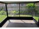 Enclosed patio with screening and view of greenery at 1922 Blue Sage Ct, Brandon, FL 33511