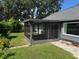 Backyard with enclosed patio area at 1922 Blue Sage Ct, Brandon, FL 33511
