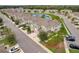 Aerial view of townhome community featuring manicured lawns, mature trees, and well-maintained streets at 1976 Marlington Way, Clearwater, FL 33763