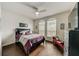 Cozy bedroom with dark wood accents and a comfortable chaise lounge at 1976 Marlington Way, Clearwater, FL 33763