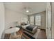 Well-lit bedroom with table and chairs, offering ample space for both relaxation and productivity at 1976 Marlington Way, Clearwater, FL 33763
