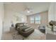 Staged bedroom showcases natural light, neutral palette, and ceiling fan at 1976 Marlington Way, Clearwater, FL 33763