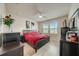 Bedroom features neutral walls, light-colored floors, and windows that let in plenty of natural light at 1976 Marlington Way, Clearwater, FL 33763