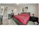 Spacious bedroom with dark wood furniture and windows providing ample natural light at 1976 Marlington Way, Clearwater, FL 33763