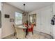 Cozy dining area with tile floors, a modern light fixture, and a window with natural light at 1976 Marlington Way, Clearwater, FL 33763