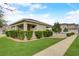 Charming home exterior featuring lush green lawn, mature landscaping, and inviting walkway at 1976 Marlington Way, Clearwater, FL 33763