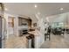 Spacious open-concept kitchen with an island, stainless steel appliances, and tile flooring at 1976 Marlington Way, Clearwater, FL 33763