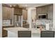 Modern kitchen featuring stainless steel appliances, granite countertops, and dark wood cabinets at 1976 Marlington Way, Clearwater, FL 33763