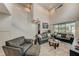 Beautiful living room featuring tile flooring, high ceilings, and comfortable furniture at 1976 Marlington Way, Clearwater, FL 33763