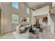 Open-concept living room with abundant natural light, high ceilings, and views of the kitchen at 1976 Marlington Way, Clearwater, FL 33763
