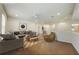 Bright, open-concept living room featuring stylish furnishings and warm hardwood flooring at 1976 Marlington Way, Clearwater, FL 33763