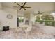 Community pool pavilion with ceiling fans, seating, and a grill at 1976 Marlington Way, Clearwater, FL 33763