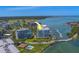 A panoramic view of the building near the bay with boat docks and a golf course at 2 Seaside Ln # 801, Belleair, FL 33756