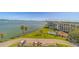 Aerial view of waterfront condos and lush green space with city views at 2 Seaside Ln # 801, Belleair, FL 33756