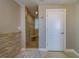 Bathroom view showcasing a tiled walk-in shower with a glass door and a separate door, complementing the neutral color scheme at 2 Seaside Ln # 801, Belleair, FL 33756