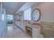 Elegant bathroom with spacious vanities, makeup table, and natural light at 2 Seaside Ln # 801, Belleair, FL 33756