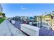 Waterfront boat slips offering convenient access and boat lifts on a sunny day at 2 Seaside Ln # 801, Belleair, FL 33756