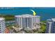 Exterior of the multi-story building highlighting the multiple private balconies with water views at 2 Seaside Ln # 801, Belleair, FL 33756