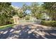 Secured community entrance with meticulously maintained landscaping and beautiful mature trees at 2 Seaside Ln # 801, Belleair, FL 33756