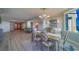 Open-concept dining area features wood floors and elegant furnishings, perfect for entertaining at 2 Seaside Ln # 801, Belleair, FL 33756