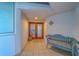 Comfortable penthouse entry area with decorative doors and a cozy bench at 2 Seaside Ln # 801, Belleair, FL 33756