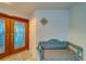 Penthouse entrance with seating and stained glass doors, welcoming guests at 2 Seaside Ln # 801, Belleair, FL 33756