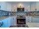 This modern kitchen features stainless steel appliances and granite countertops at 2 Seaside Ln # 801, Belleair, FL 33756
