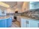 This kitchen features stainless steel appliances, tile backsplash, and marble countertops at 2 Seaside Ln # 801, Belleair, FL 33756