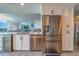 Bright kitchen with stainless steel appliances, granite countertops, and custom cabinetry at 2 Seaside Ln # 801, Belleair, FL 33756