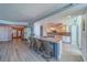 Bright, modern kitchen features an island with barstool seating and stylish backsplash at 2 Seaside Ln # 801, Belleair, FL 33756