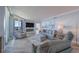 Bright living room with fireplace, comfortable seating, and beautiful natural light at 2 Seaside Ln # 801, Belleair, FL 33756