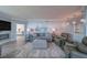 Comfortable living room with modern fireplace, comfortable seating, and beautiful natural light at 2 Seaside Ln # 801, Belleair, FL 33756