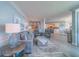 Open-concept living room with stylish furnishings and access to the dining and kitchen areas at 2 Seaside Ln # 801, Belleair, FL 33756