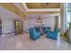 Inviting lobby with elegant seating area featuring plush blue armchairs and decorative accents at 2 Seaside Ln # 801, Belleair, FL 33756