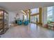Bright lobby with chairs, chandelier and large windows at 2 Seaside Ln # 801, Belleair, FL 33756