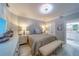 Bright main bedroom features a well-placed bed and an attached ensuite bathroom at 2 Seaside Ln # 801, Belleair, FL 33756