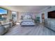 Elegantly styled main bedroom with ensuite bathroom, comfortable seating, and ample natural light at 2 Seaside Ln # 801, Belleair, FL 33756