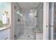 Luxurious walk-in shower featuring marble tile, a built-in bench, and rainfall showerhead at 2 Seaside Ln # 801, Belleair, FL 33756